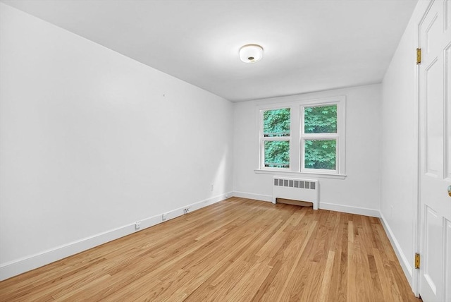 209 Brookside Rd, Needham, MA 02492 - unfurnished room featuring radiator and light wood finished floors