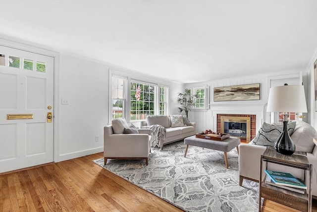 209 Brookside Rd, Needham, MA 02492 - living area featuring wood finished floors and a brick fireplace