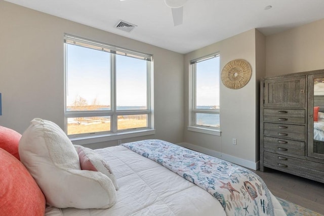 bedroom with hardwood / wood-style flooring and ceiling fan