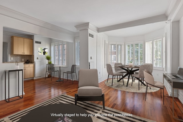 living room with wood-type flooring and crown molding