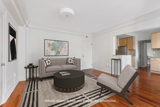 living room with crown molding and hardwood / wood-style flooring