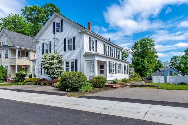 129 Vernon St Unit B, Norwood, MA 02062 - view of front of house featuring a chimney
