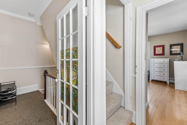129 Vernon St Unit B, Norwood, MA 02062 - staircase with wood finished floors, a wainscoted wall, and baseboards
