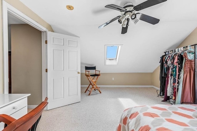 129 Vernon St Unit B, Norwood, MA 02062 - bedroom with a skylight, light colored carpet, lofted ceiling, baseboards, and a ceiling fan
