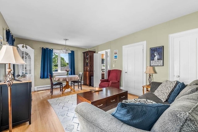 129 Vernon St Unit B, Norwood, MA 02062 - living room featuring light wood finished floors and a chandelier