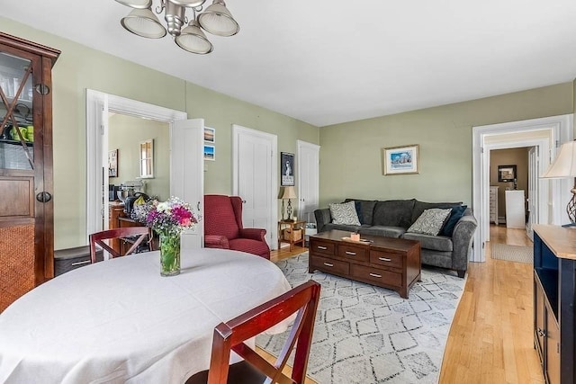 129 Vernon St Unit B, Norwood, MA 02062 - dining room featuring a chandelier and light wood-type flooring