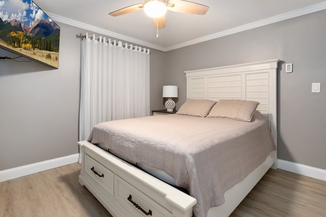 bedroom with light wood-type flooring, crown molding, and ceiling fan