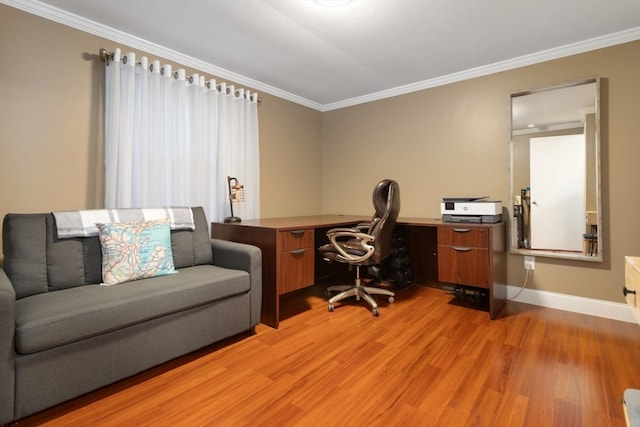 office space with ornamental molding and light wood-type flooring