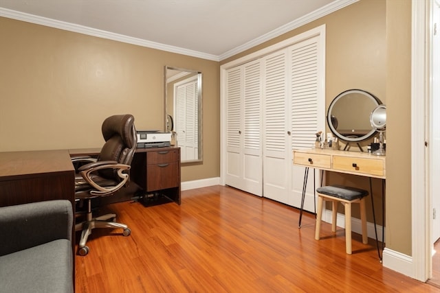 office space featuring ornamental molding and light hardwood / wood-style floors