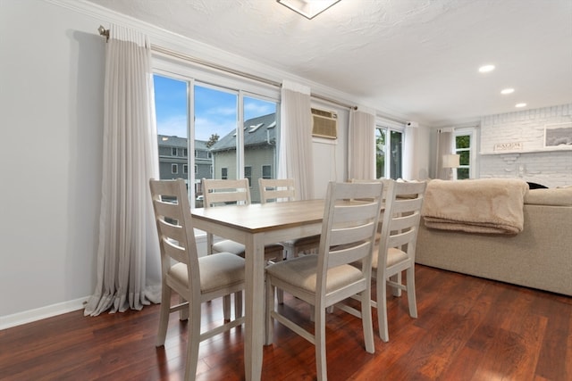 dining space with ornamental molding, a wealth of natural light, and dark wood-type flooring