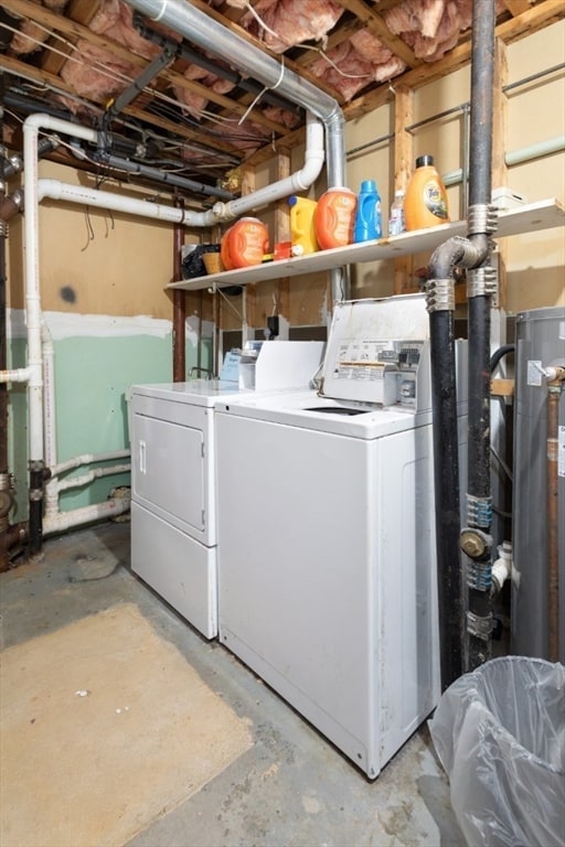 clothes washing area featuring independent washer and dryer