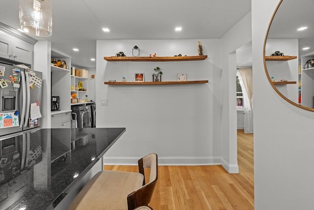 100 Ashland St, Lynn, MA 01905 - kitchen with open shelves, light wood-type flooring, stainless steel fridge with ice dispenser, dark stone countertops, and recessed lighting
