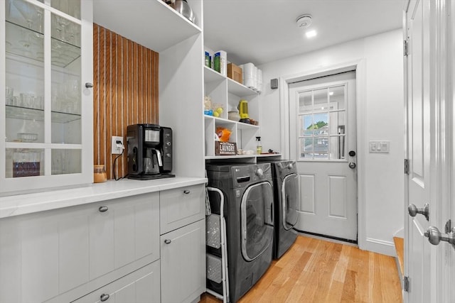 100 Ashland St, Lynn, MA 01905 - washroom featuring light wood-style flooring, independent washer and dryer, and cabinet space
