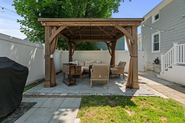 100 Ashland St, Lynn, MA 01905 - fenced backyard with outdoor lounge area, a gazebo, grilling area, and a patio
