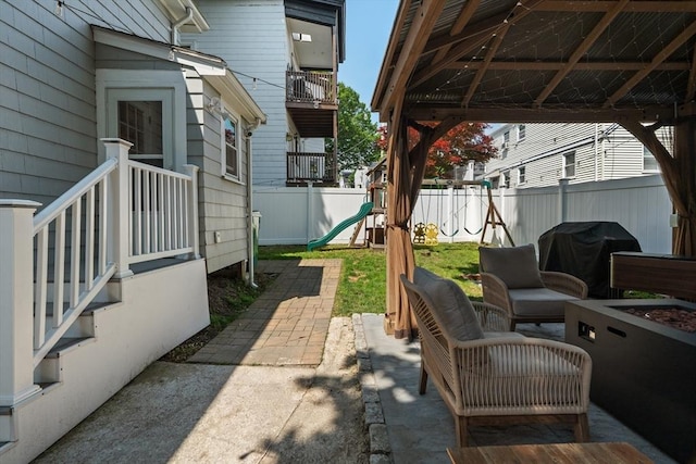 100 Ashland St, Lynn, MA 01905 - fenced backyard with a playground, grilling area, and a patio area