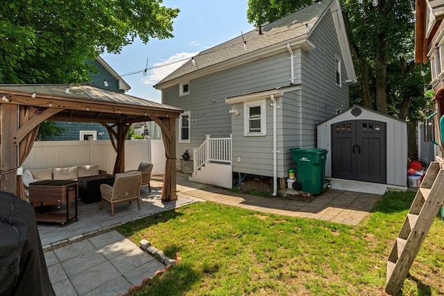 100 Ashland St, Lynn, MA 01905 - back of property with a gazebo, outdoor lounge area, a patio area, and a storage unit