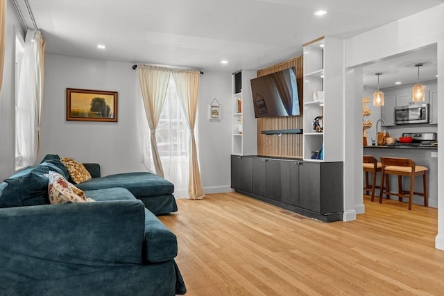 100 Ashland St, Lynn, MA 01905 - living room with light wood-style floors and recessed lighting