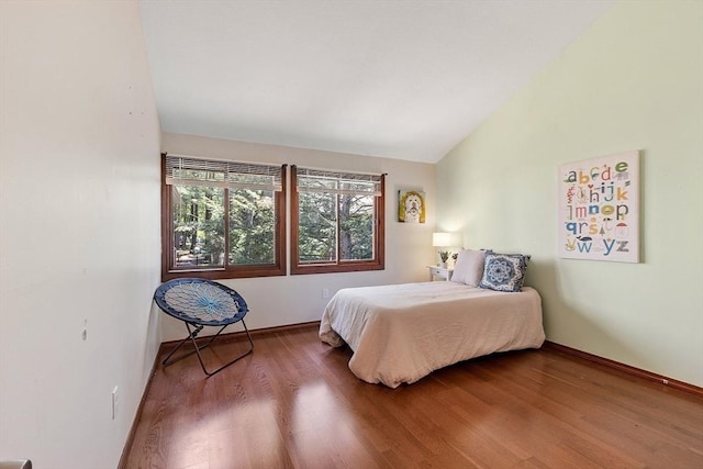 525 Tumbling Hawk Unit 525, Acton, MA 01720 - bedroom with wood finished floors, lofted ceiling, and baseboards