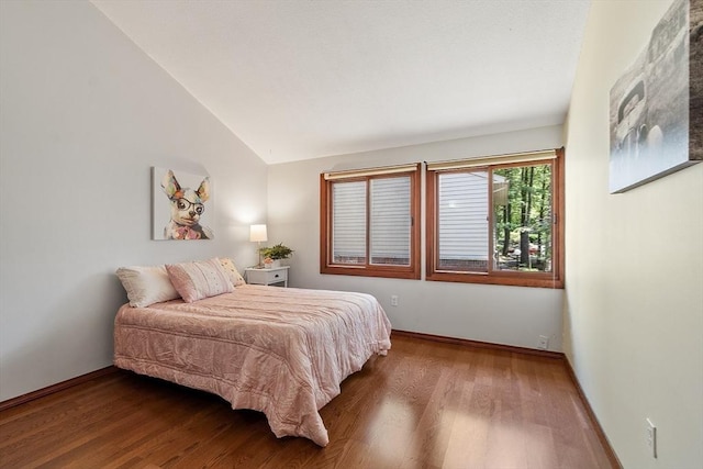 525 Tumbling Hawk Unit 525, Acton, MA 01720 - bedroom with wood finished floors, lofted ceiling, and baseboards