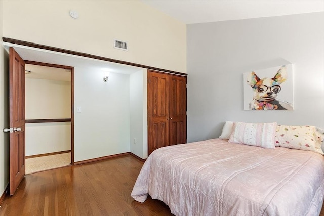 525 Tumbling Hawk Unit 525, Acton, MA 01720 - bedroom featuring wood finished floors, a closet, and baseboards