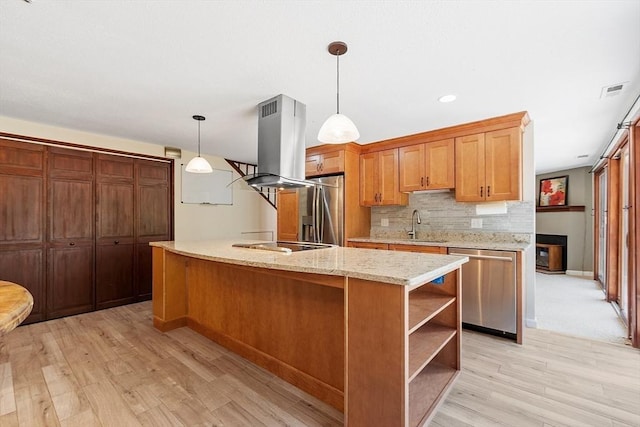 525 Tumbling Hawk Unit 525, Acton, MA 01720 - kitchen featuring stainless steel appliances, island exhaust hood, light wood finished floors, open shelves, and decorative backsplash