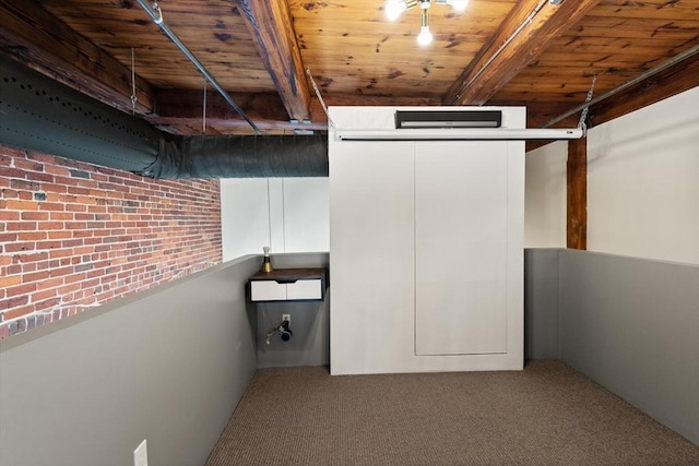 below grade area with carpet flooring and wooden ceiling