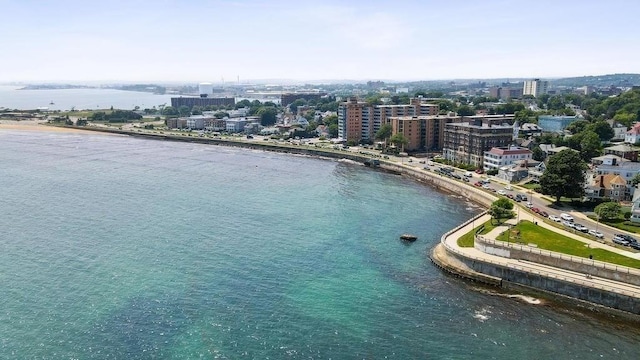 drone / aerial view featuring a water view and a city view