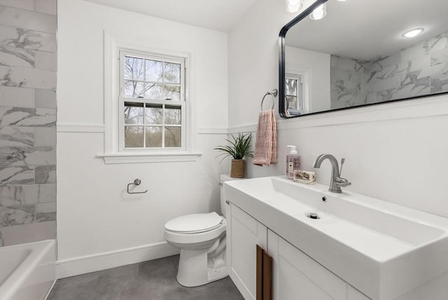 full bath featuring toilet, concrete floors, baseboards, and vanity