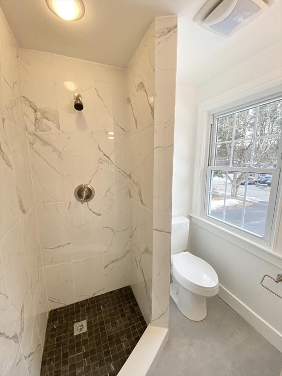 full bath with visible vents, tiled shower, and toilet