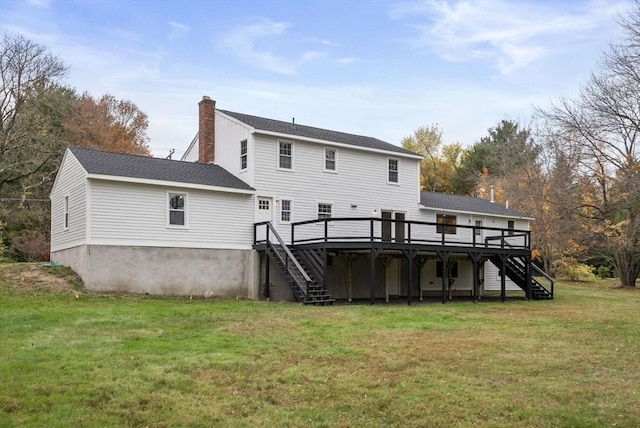 back of house with stairs, a yard, a chimney, and a wooden deck