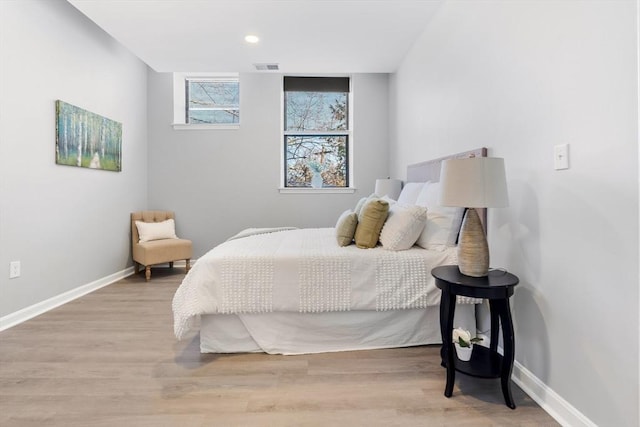 bedroom with light wood-type flooring