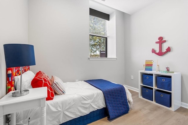 bedroom with wood-type flooring