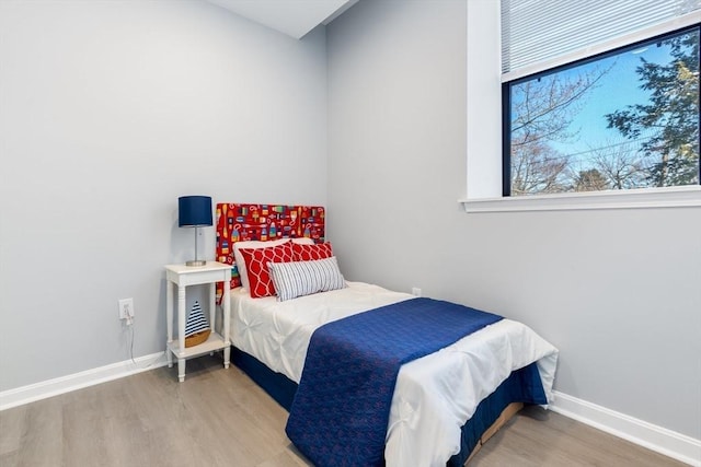 bedroom featuring wood-type flooring