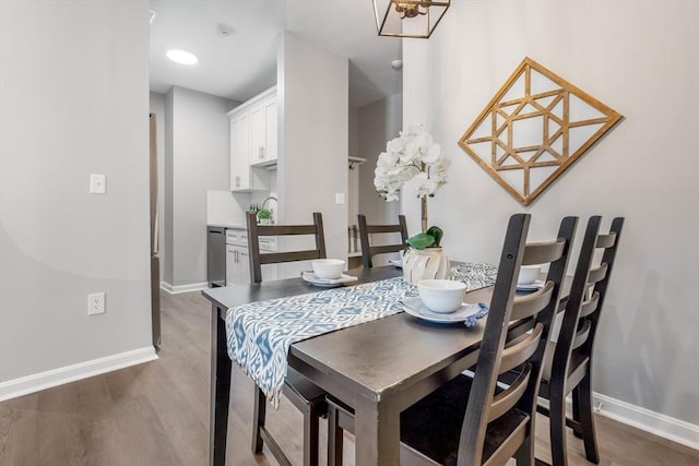 dining room with dark wood-type flooring