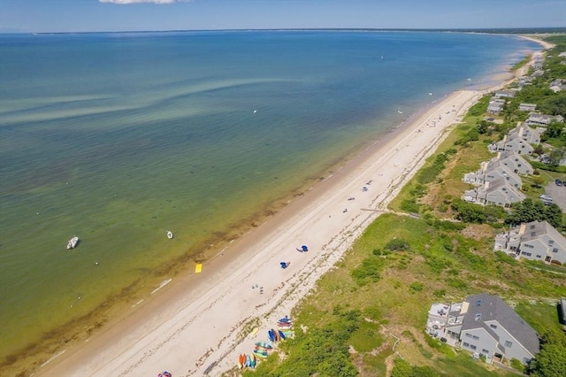 bird's eye view featuring a water view and a view of the beach