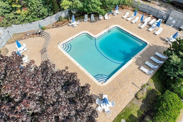pool featuring a patio area and fence