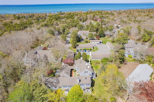 drone / aerial view featuring a residential view and a water view