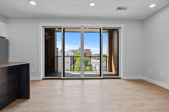 277 Border St Unit 502, Boston, MA 02128 - unfurnished room featuring light wood finished floors, baseboards, and recessed lighting
