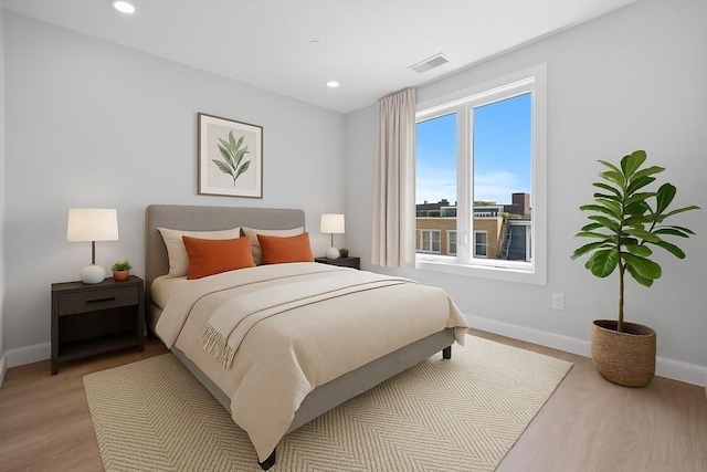 277 Border St Unit 502, Boston, MA 02128 - bedroom featuring baseboards, light wood-type flooring, and recessed lighting