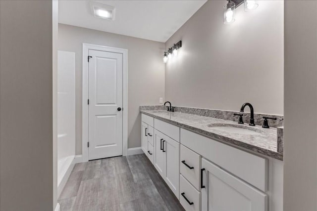 6 Nicols Way Unit 6, Easthampton, MA 01027 - bathroom featuring double vanity and wood finished floors