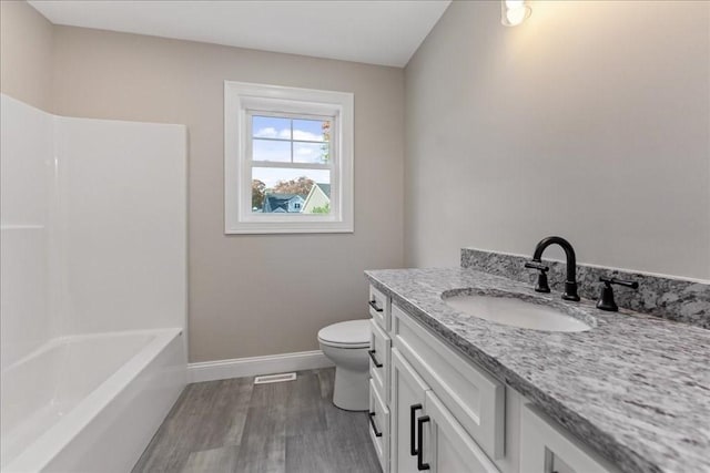 6 Nicols Way Unit 6, Easthampton, MA 01027 - bathroom featuring vanity, wood finished floors, and washtub / shower combination