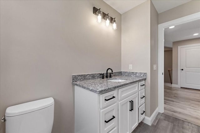 6 Nicols Way Unit 6, Easthampton, MA 01027 - half bath featuring vanity, wood finished floors, and recessed lighting