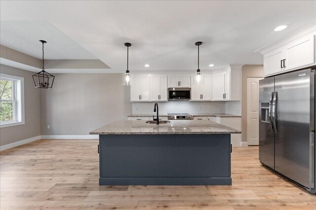 6 Nicols Way Unit 6, Easthampton, MA 01027 - kitchen featuring stainless steel appliances, white cabinets, light stone countertops, recessed lighting, and light wood finished floors