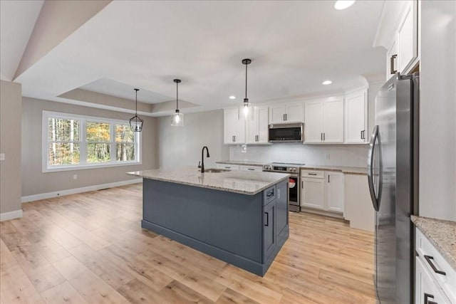 6 Nicols Way Unit 6, Easthampton, MA 01027 - kitchen with appliances with stainless steel finishes, white cabinets, tasteful backsplash, light wood-style floors, and recessed lighting
