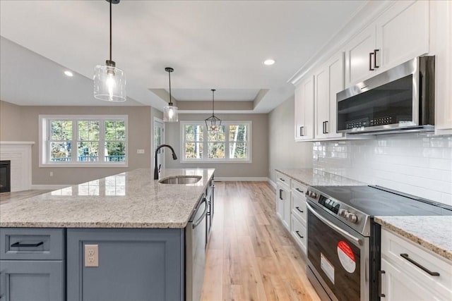 6 Nicols Way Unit 6, Easthampton, MA 01027 - kitchen featuring appliances with stainless steel finishes, light wood-style floors, plenty of natural light, tasteful backsplash, and recessed lighting
