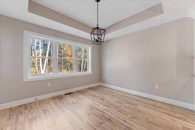 6 Nicols Way Unit 6, Easthampton, MA 01027 - empty room with a chandelier, wood finished floors, and a tray ceiling