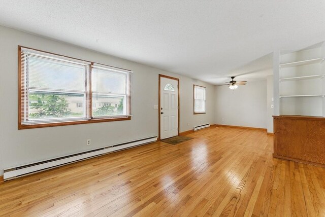 215 Pine Acre Rd, Springfield, MA 01129 - unfurnished living room featuring a baseboard radiator, light wood finished floors, and ceiling fan