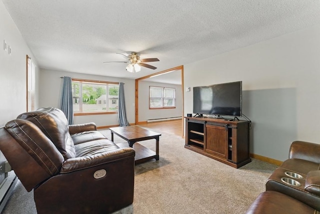 215 Pine Acre Rd, Springfield, MA 01129 - living area with a baseboard heating unit, ceiling fan, carpet floors, baseboards, and a textured ceiling