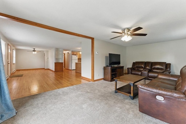 215 Pine Acre Rd, Springfield, MA 01129 - carpeted living room featuring a ceiling fan, baseboards, and wood finished floors