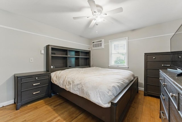 215 Pine Acre Rd, Springfield, MA 01129 - bedroom featuring light wood finished floors, a wall unit AC, baseboards, and a ceiling fan